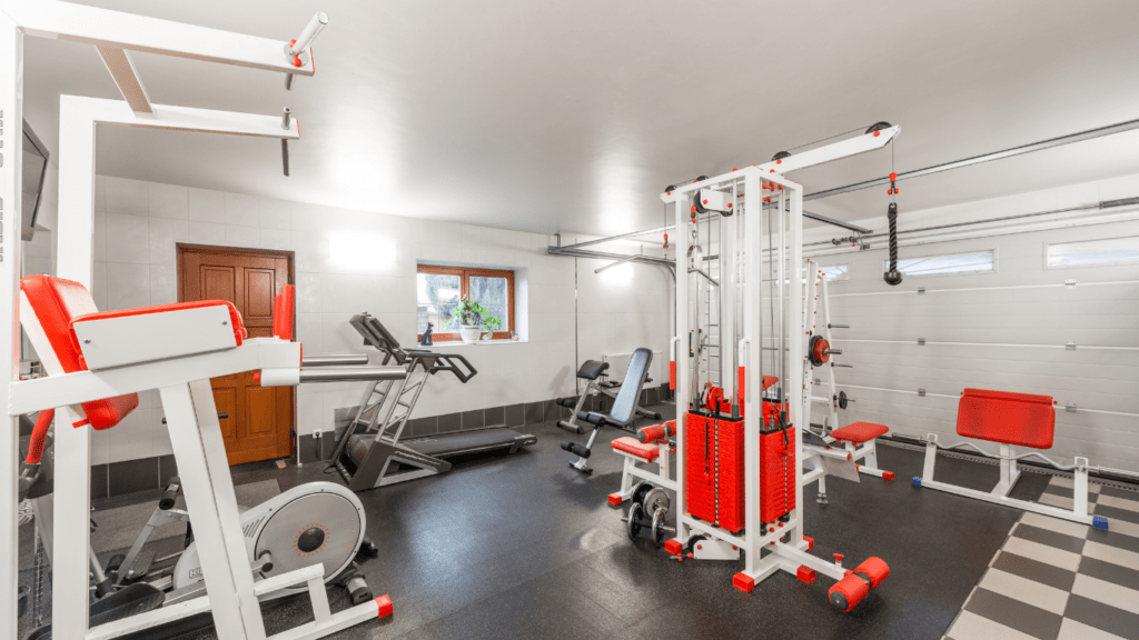 a gym room with exercise equipment in it