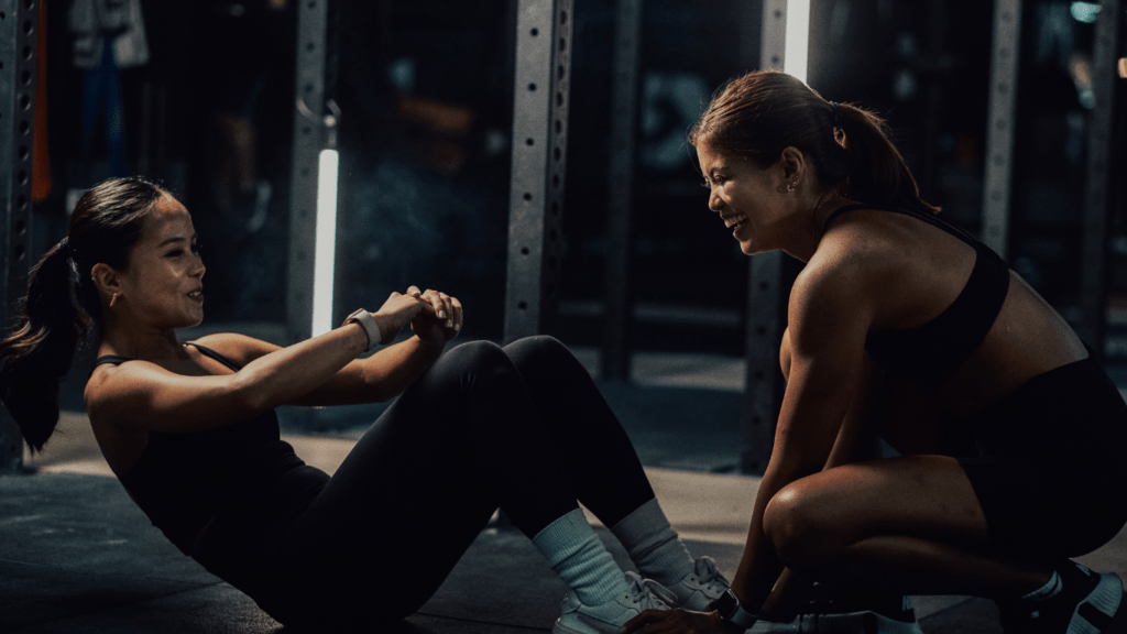 Two people working out at the gym