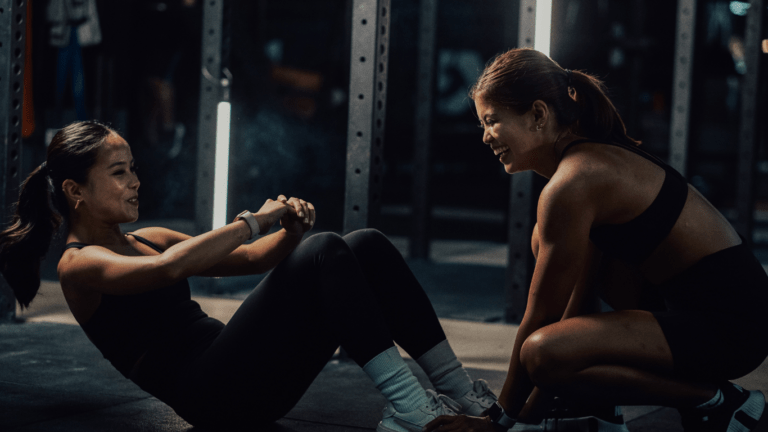 Two people working out at the gym