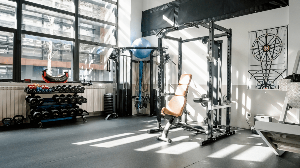 a gym room with exercise equipment in it