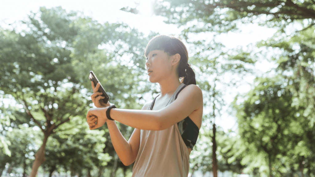 a person is looking at their watch on the road