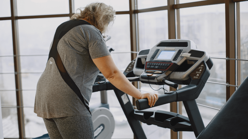 a person on a treadmill in a gym