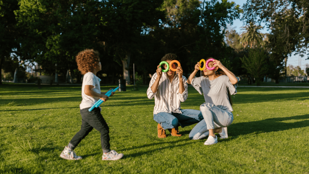 an image of a family playing in the park