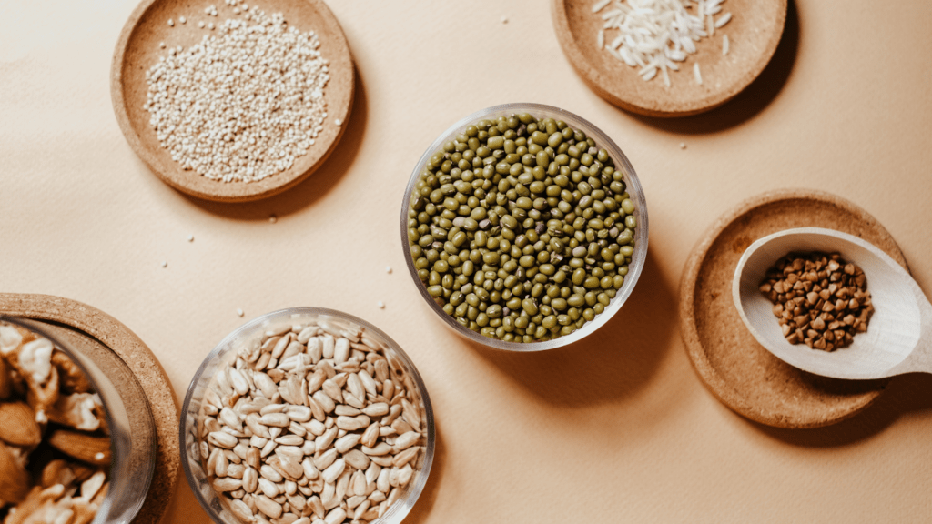 different types of nuts in bowls on a wooden table