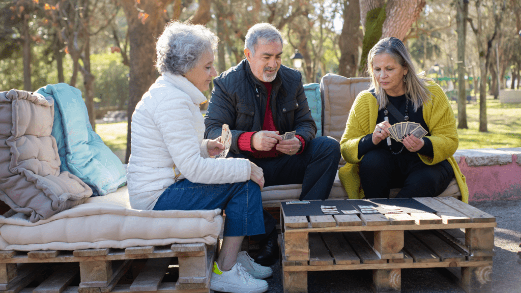 individuals sitting on a bench in a park