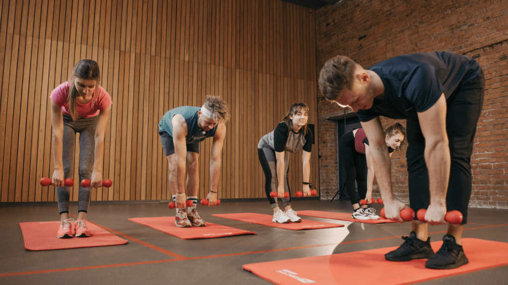 person doing stretching exercises in the gym