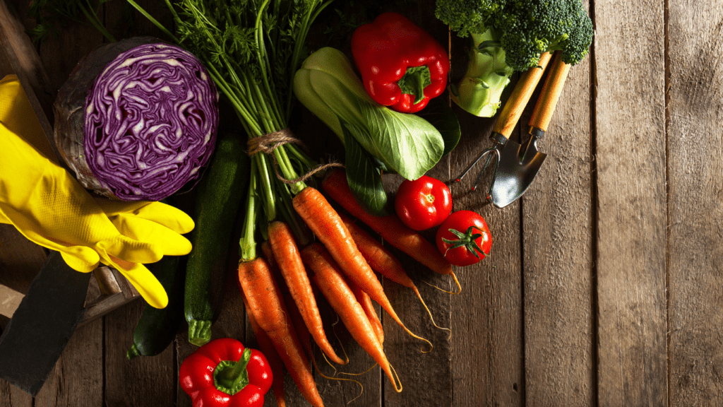 vegetables and fruits are arranged on a table