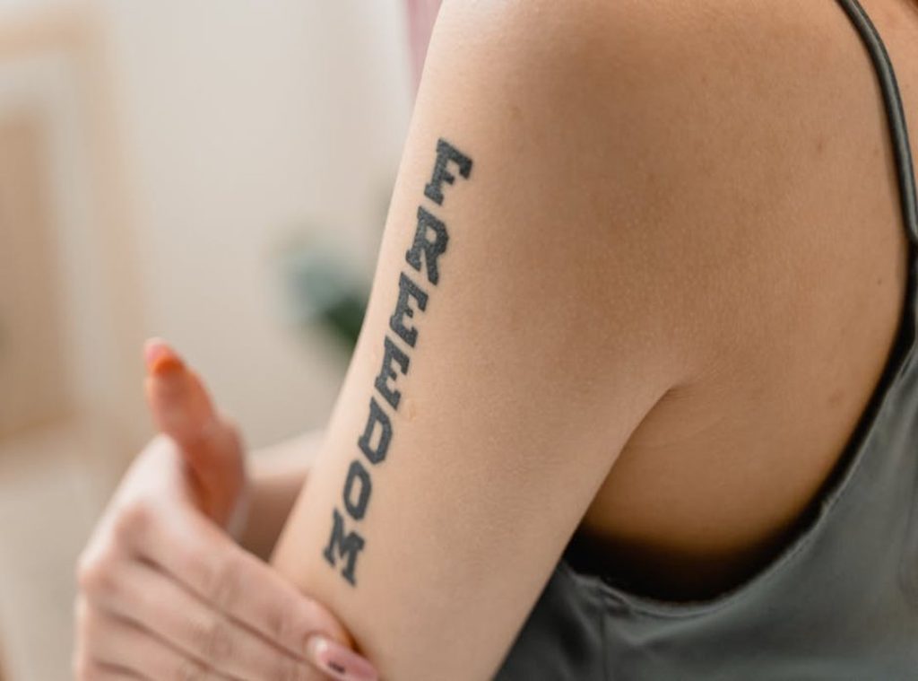 meaningful female classy half sleeve tattoo