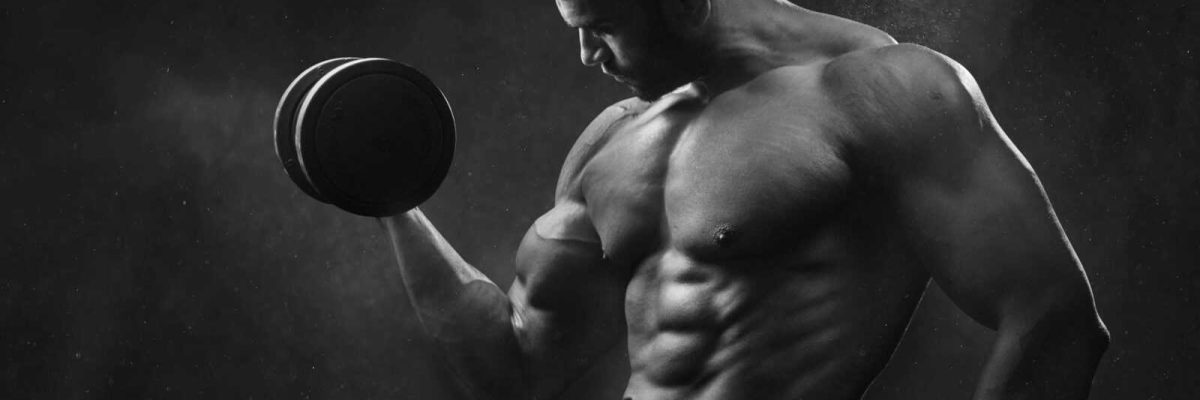 Man Holding Black Dumbbell